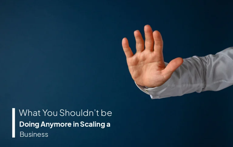 Hand making a stop sign gesture over a blue background with text about mistakes to avoid when scaling a business effectively