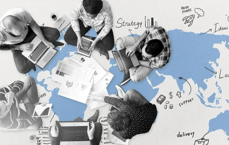 High-performing executive assistant team collaborating remotely across a world map, using laptops and documents to plan strategy and support.