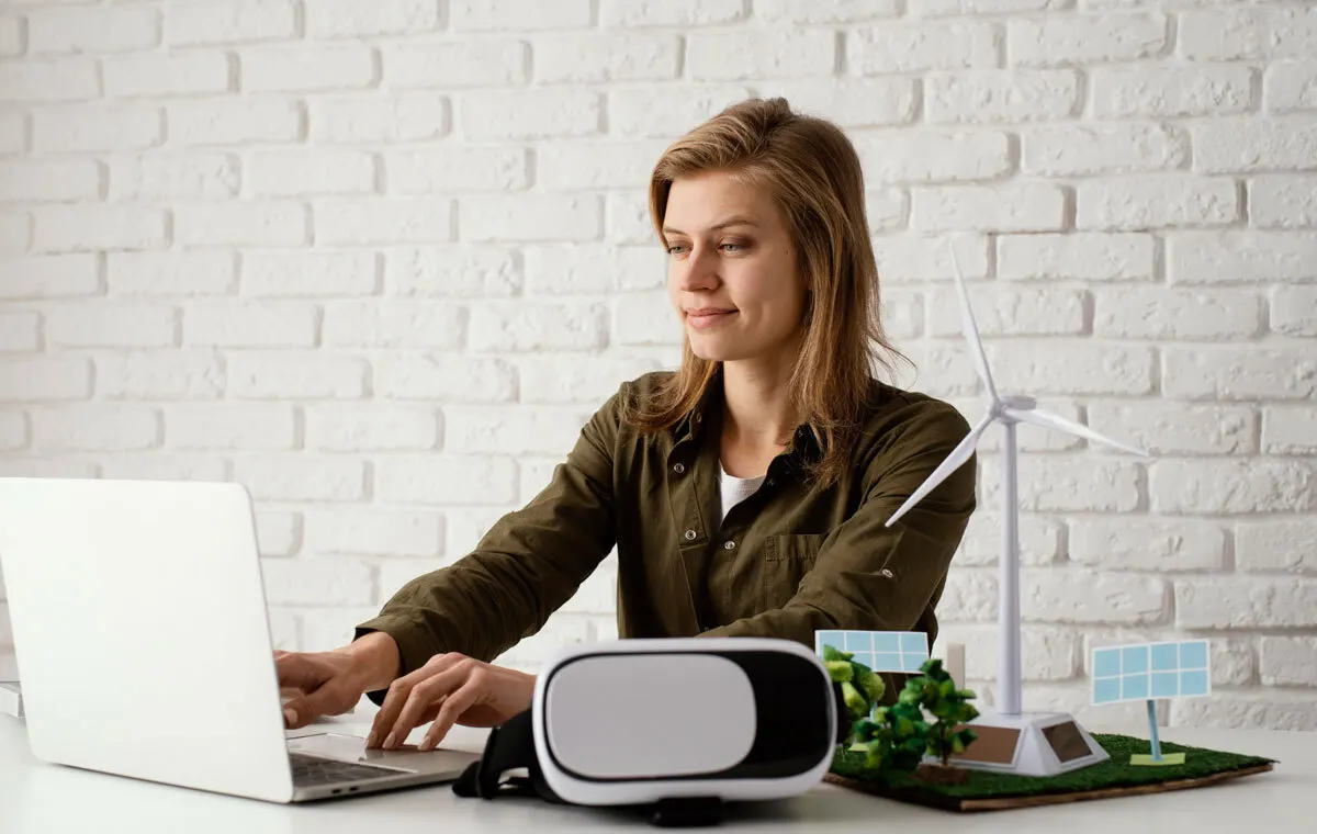 Professional demonstrating remote work trends working from home office with laptop in modern flexible workspace